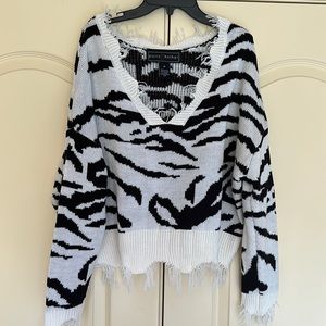 Black and white oversized, distressed neck and bottom sweater